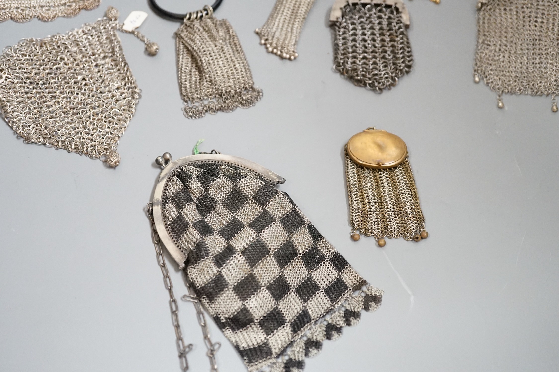 A collection of 19th century multi coloured metal chain mail evening bags and purses (14)
